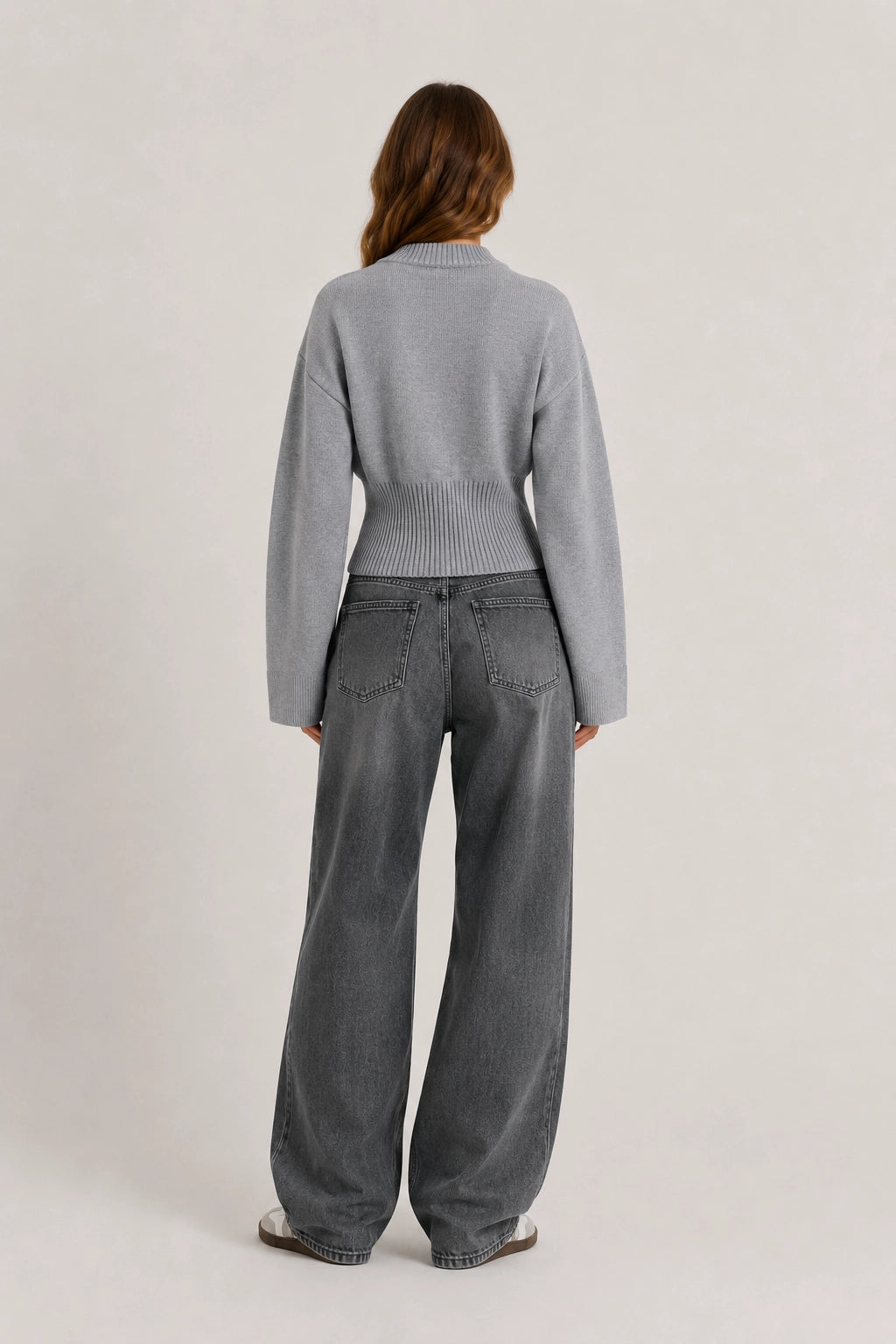 Silver crew-neck knit sweater with ribbed collar and cuffs, back view