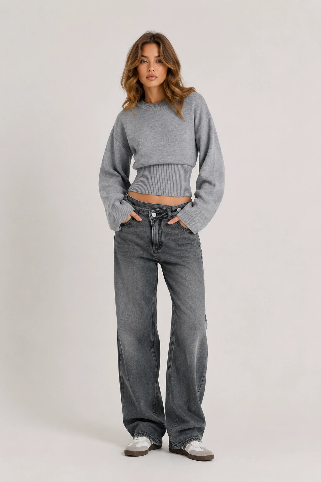 Silver knit sweater with crew neck, ribbed cuffs, and fitted hem