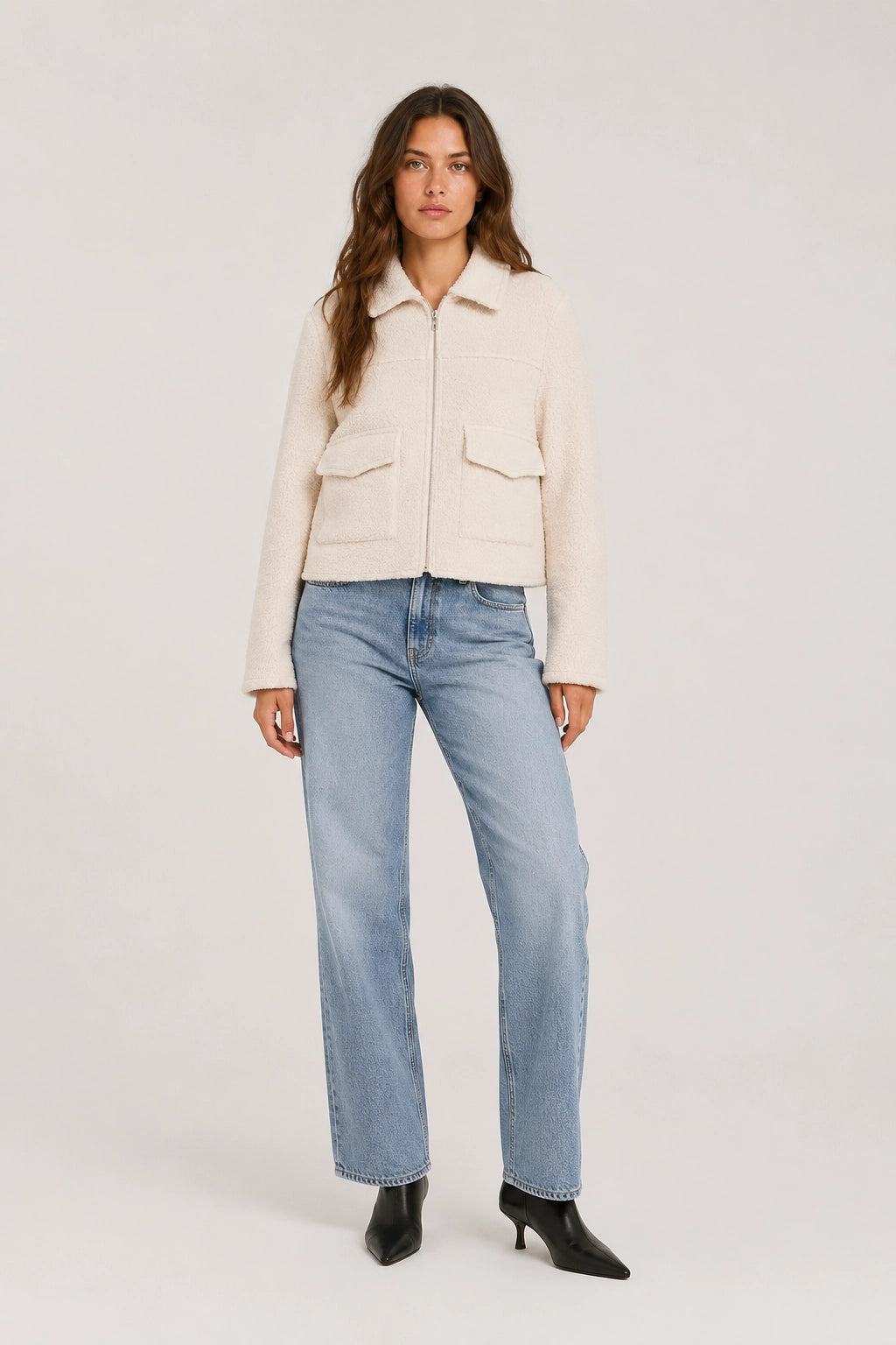 Beige cropped jacket with zip front, stand collar, and flap chest pockets