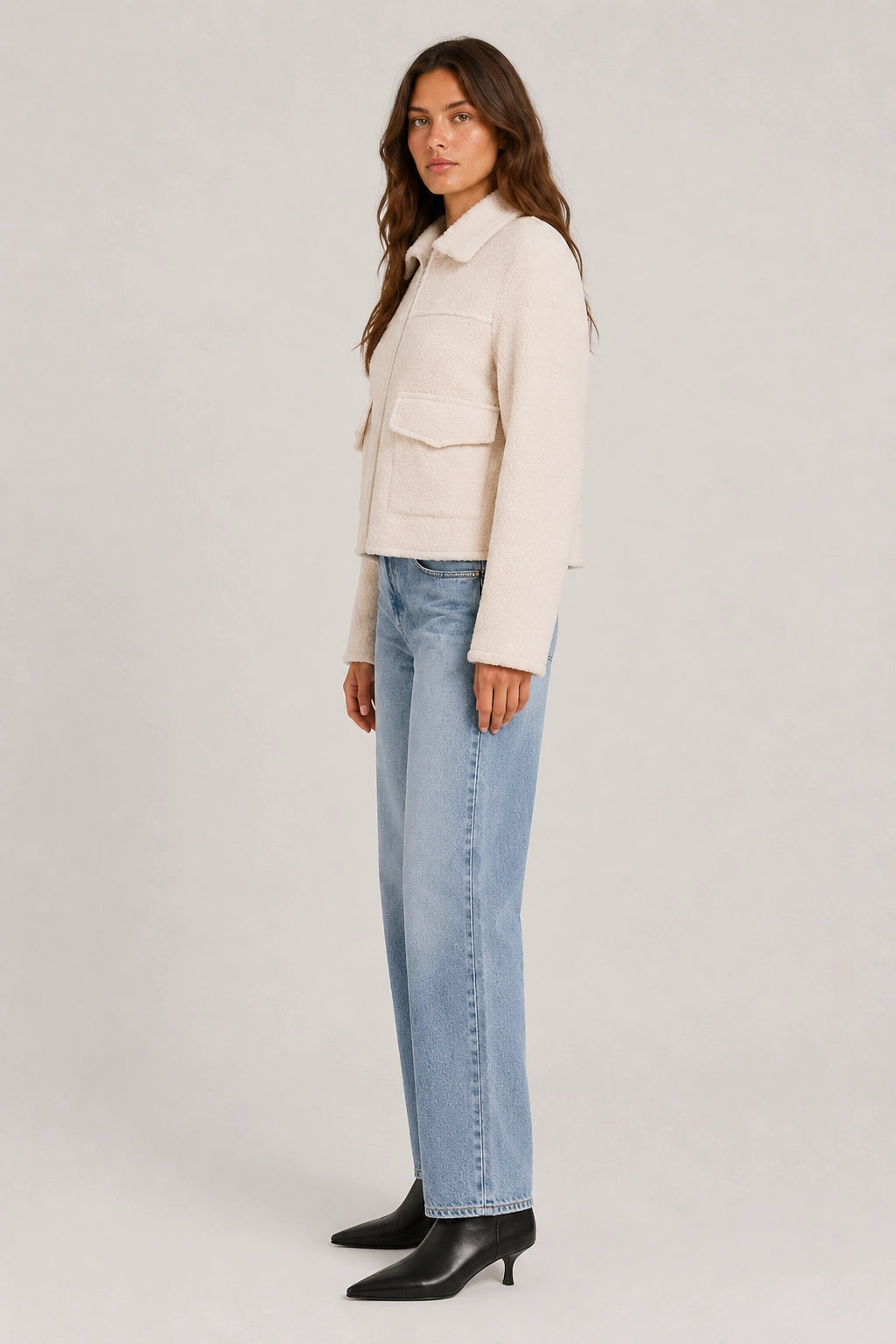 Beige cropped jacket with zip front and flap pockets, side view