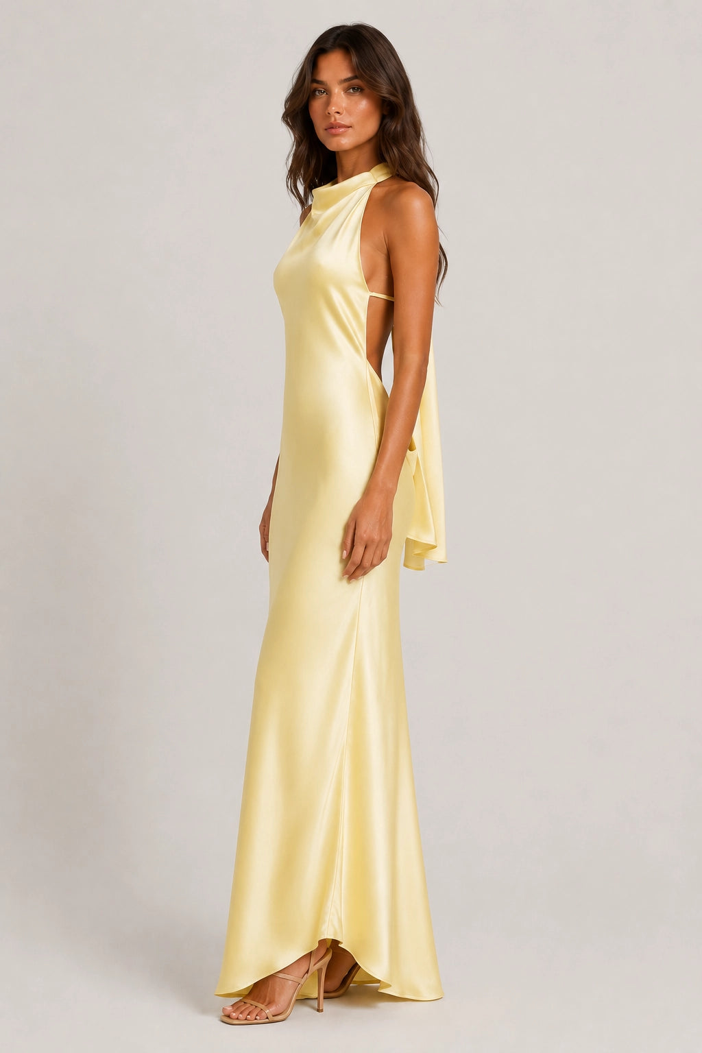 Yellow sleeveless maxi dress with high neckline and draped side tie detail