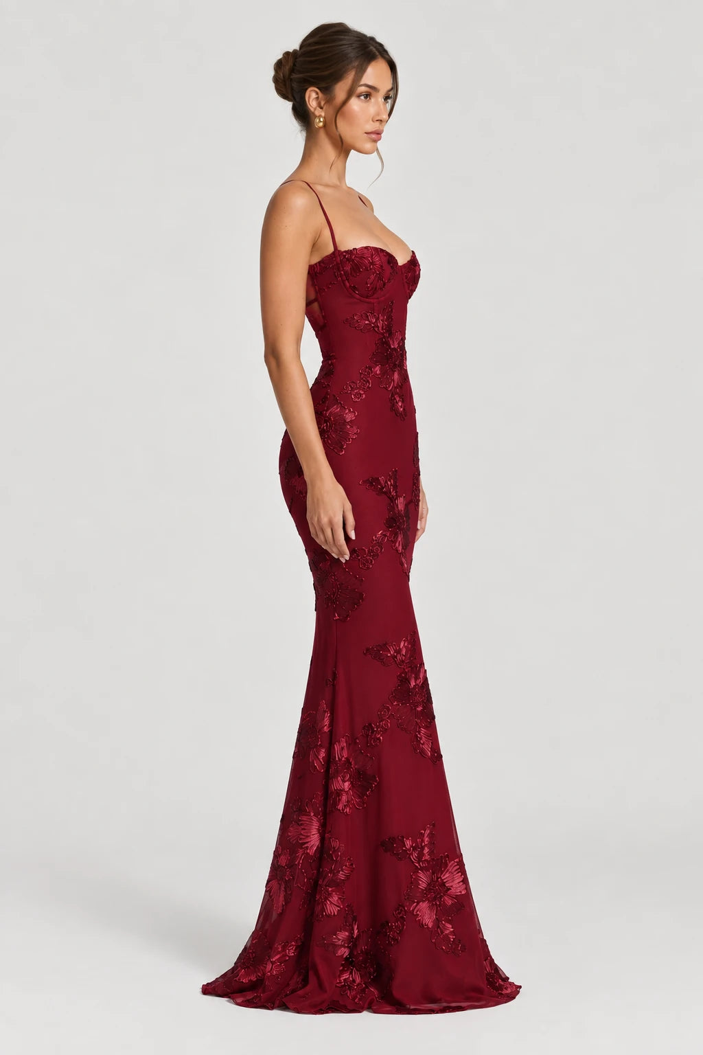 Burgundy floral corset maxi dress with thin straps and fitted silhouette, side view
