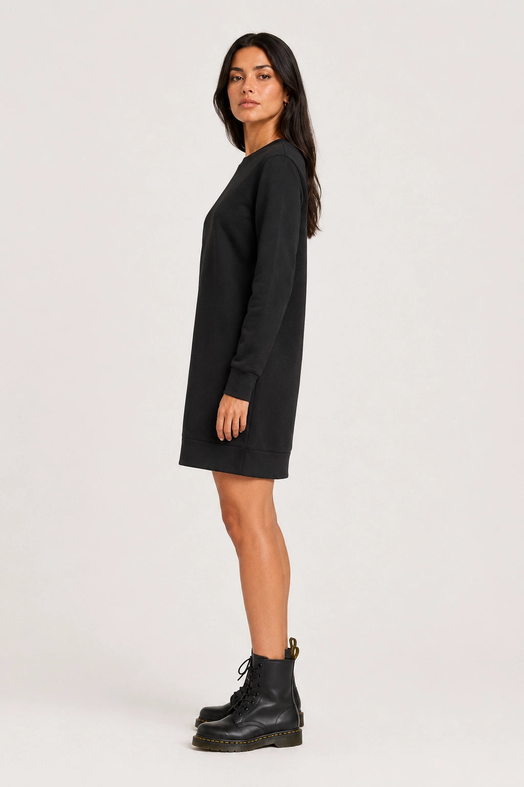 Black crew-neck long-sleeve shift dress side view with straight hem and relaxed fit